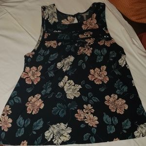 Black flowy top with floral print.